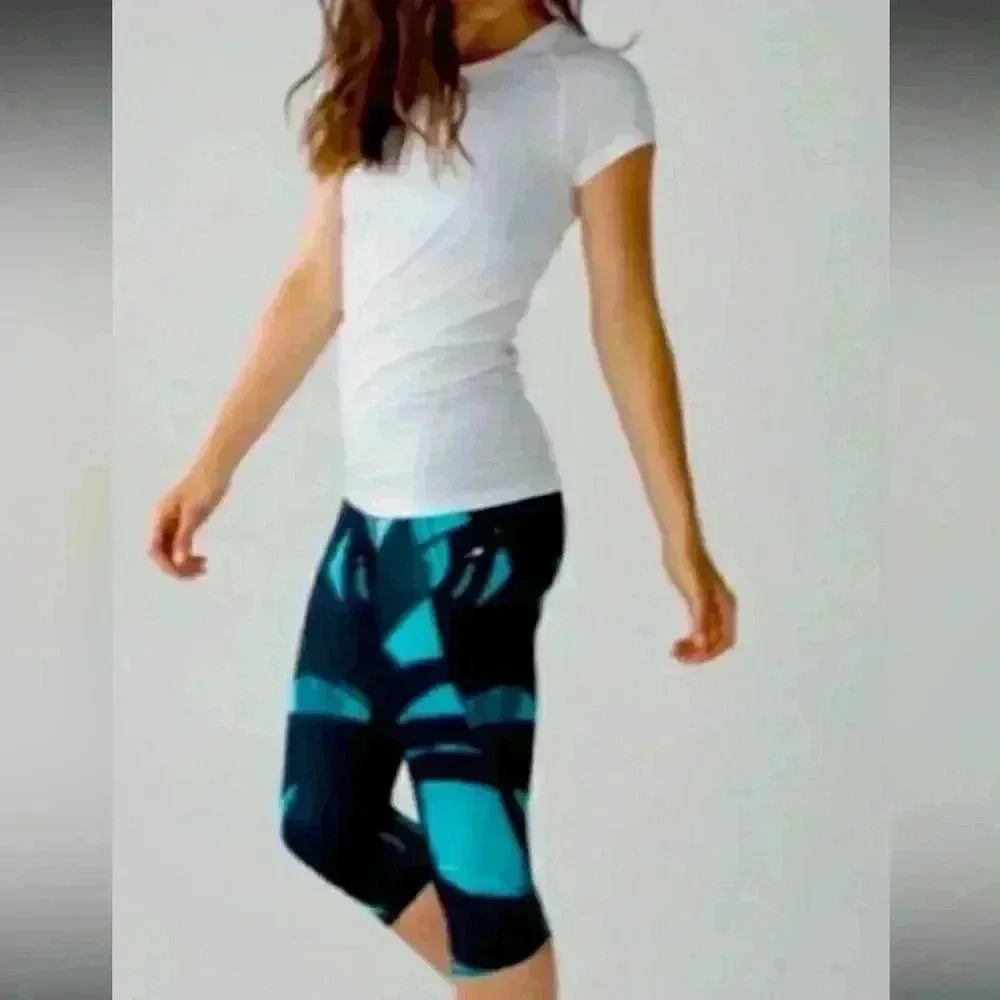 Lululemon Women 8 Run Top Speed Crop Legging Back Spin Stroke Peacock Blue Black